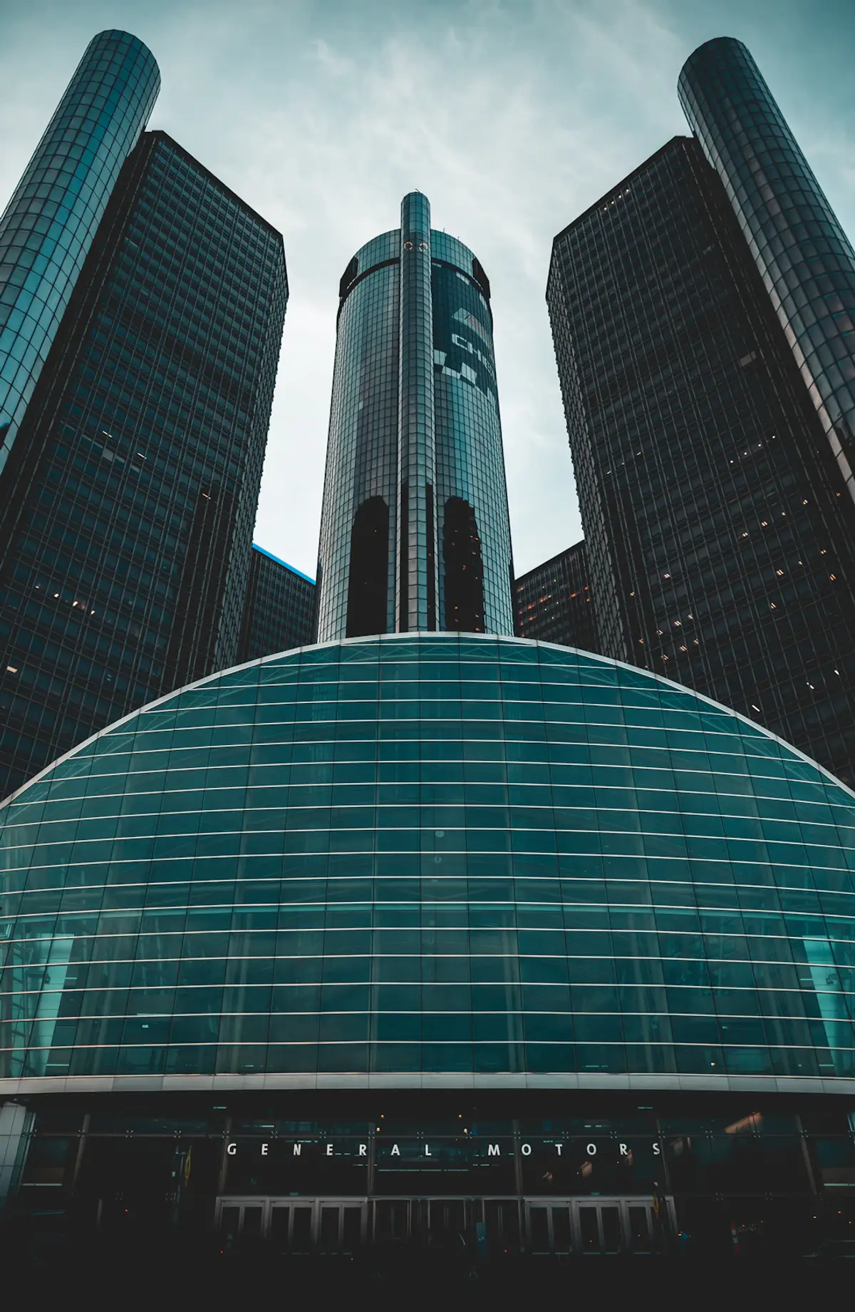 a group of people in front of a brick building