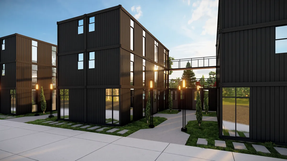 Person in red sweater holding baby's hand.